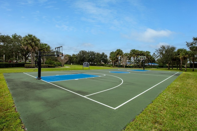 view of sport court featuring community basketball court and a lawn