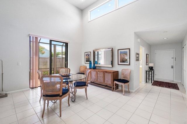 65 Eastgate Dr Unit B, Boynton Beach, FL 33436 - dining space with plenty of natural light, baseboards, a high ceiling, and light tile patterned floors