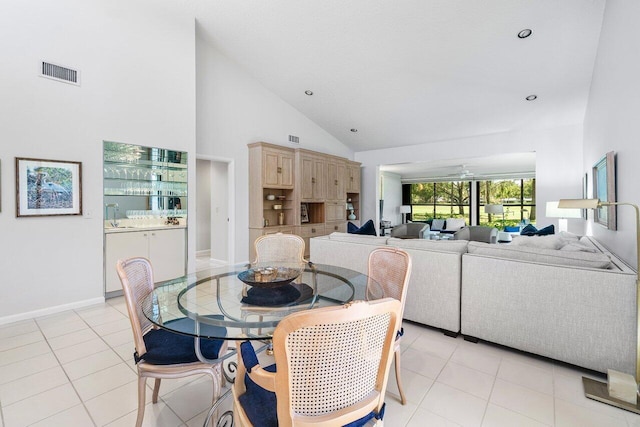 65 Eastgate Dr Unit B, Boynton Beach, FL 33436 - dining area with light tile patterned floors, high vaulted ceiling, baseboards, and recessed lighting