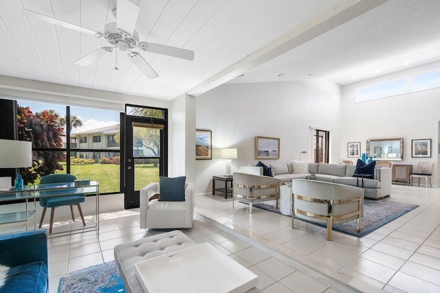 65 Eastgate Dr Unit B, Boynton Beach, FL 33436 - living room with light tile patterned floors, ceiling fan, and high vaulted ceiling