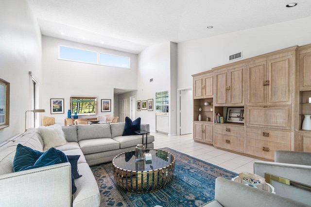 65 Eastgate Dr Unit B, Boynton Beach, FL 33436 - living area featuring a towering ceiling, light tile patterned floors, and recessed lighting