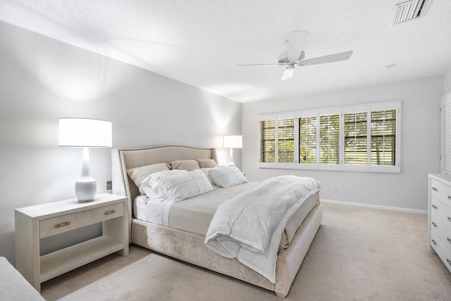 65 Eastgate Dr Unit B, Boynton Beach, FL 33436 - bedroom with light carpet, a textured ceiling, ceiling fan, and baseboards