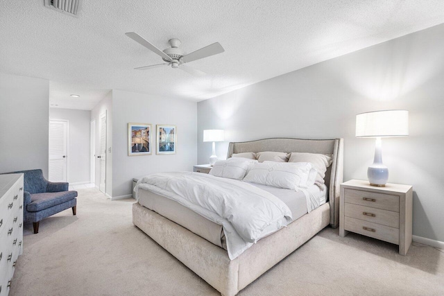 65 Eastgate Dr Unit B, Boynton Beach, FL 33436 - bedroom featuring light carpet, a ceiling fan, baseboards, a textured ceiling, and a closet