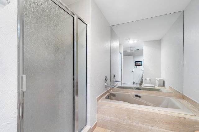 65 Eastgate Dr Unit B, Boynton Beach, FL 33436 - full bath featuring a stall shower, toilet, a garden tub, ceiling fan, and a textured wall
