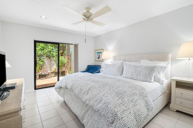 65 Eastgate Dr Unit B, Boynton Beach, FL 33436 - bedroom featuring access to outside, light tile patterned floors, a ceiling fan, and a textured ceiling