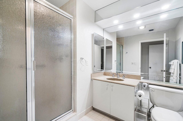 65 Eastgate Dr Unit B, Boynton Beach, FL 33436 - full bathroom featuring a stall shower, toilet, vanity, tile patterned floors, and recessed lighting