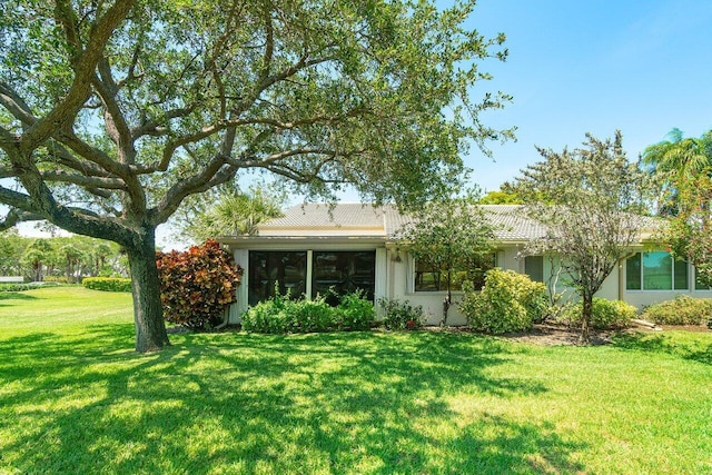 65 Eastgate Dr Unit B, Boynton Beach, FL 33436 - rear view of house with a yard and stucco siding