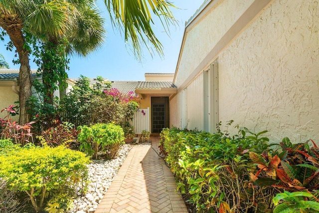 65 Eastgate Dr Unit B, Boynton Beach, FL 33436 - view of exterior entry featuring stucco siding