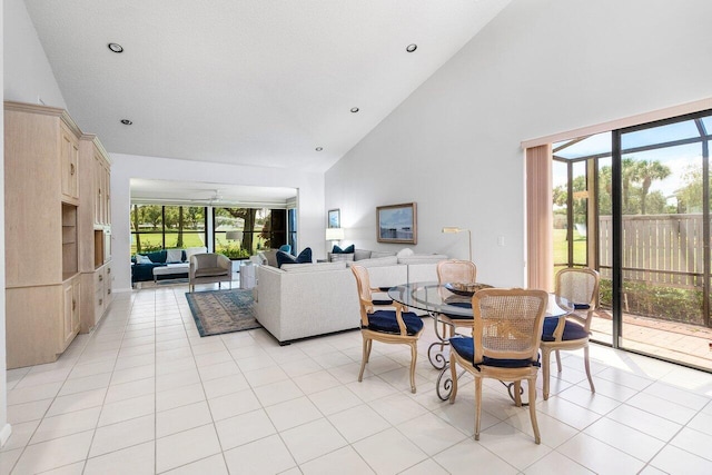 65 Eastgate Dr Unit B, Boynton Beach, FL 33436 - dining room featuring high vaulted ceiling, light tile patterned flooring, plenty of natural light, and recessed lighting