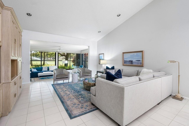 65 Eastgate Dr Unit B, Boynton Beach, FL 33436 - living area with light tile patterned floors, vaulted ceiling, a ceiling fan, baseboards, and recessed lighting