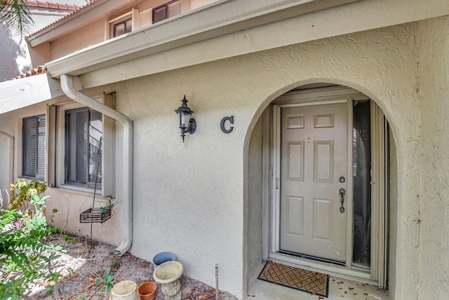 5640 Coach House Cir Unit C, Boca Raton, FL 33486 - doorway to property featuring stucco siding