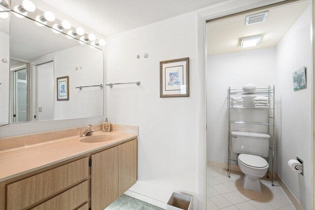 1401 Tidal Pointe Blvd Unit 405, Jupiter, FL 33477 - bathroom with toilet, vanity, tile patterned floors, and baseboards