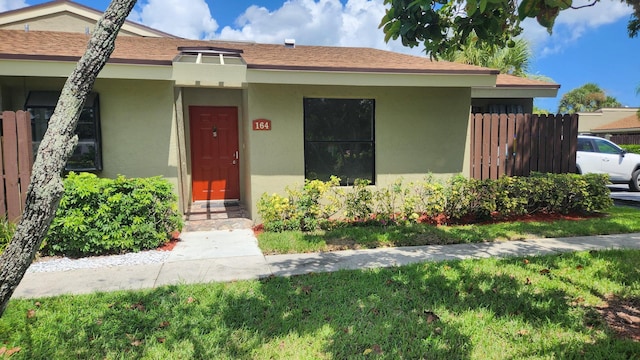 164 Meadows Dr, Boynton Beach, FL 33436 - view of front of house with stucco siding
