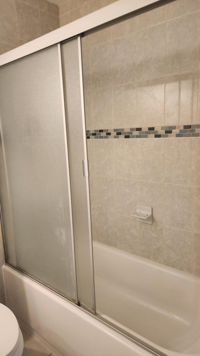 164 Meadows Dr, Boynton Beach, FL 33436 - full bathroom featuring toilet and bath / shower combo with glass door