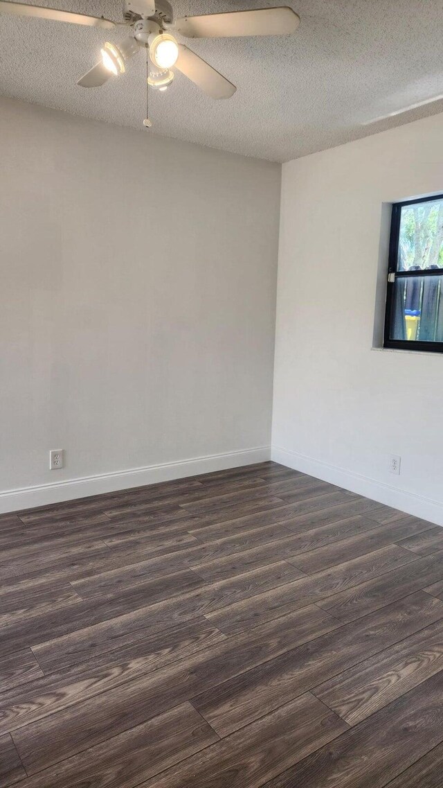 164 Meadows Dr, Boynton Beach, FL 33436 - empty room featuring dark wood-style floors, a textured ceiling, and ceiling fan