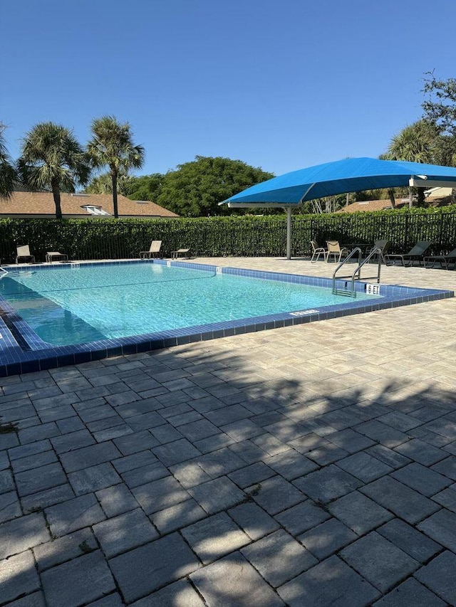 164 Meadows Dr, Boynton Beach, FL 33436 - community pool featuring a patio