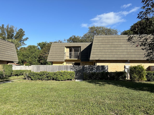 4505 45th Way, West Palm Beach, FL 33407 - view of side of property with mansard roof and brick siding
