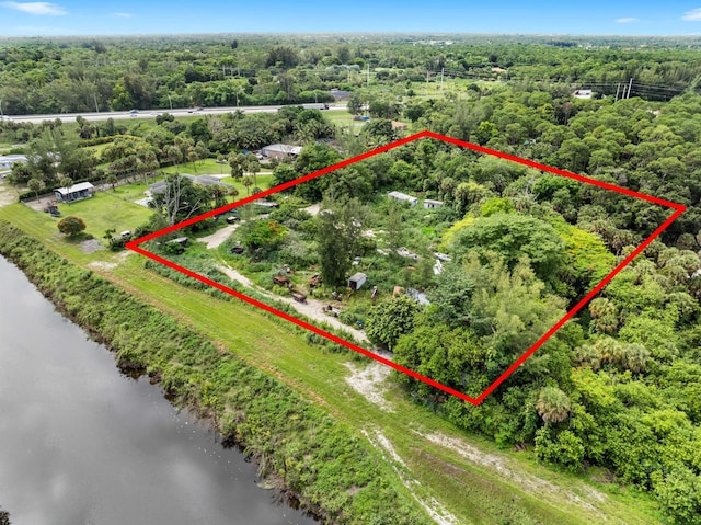 69 Armadillo Way, West Palm Beach, FL 33411 - aerial overview of property's location with a large body of water and property boundaries highlighted