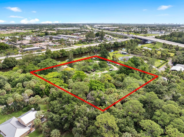 69 Armadillo Way, West Palm Beach, FL 33411 - aerial view of property's location with property parcel outlined, a notable bridge, and a large body of water
