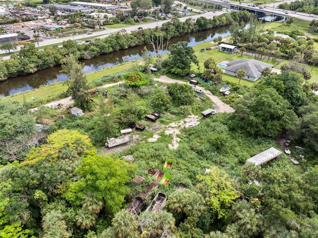 69 Armadillo Way, West Palm Beach, FL 33411 - aerial overview of property's location featuring a large body of water, a notable bridge, and a tree filled landscape