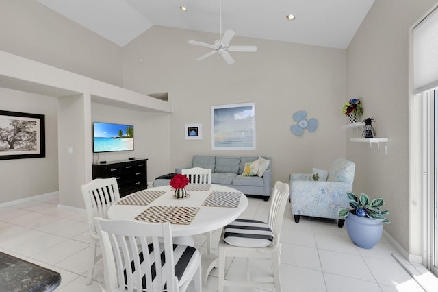 6179 Evian Pl, Boynton Beach, FL 33437 - dining area featuring ceiling fan, light tile patterned flooring, baseboards, and high vaulted ceiling