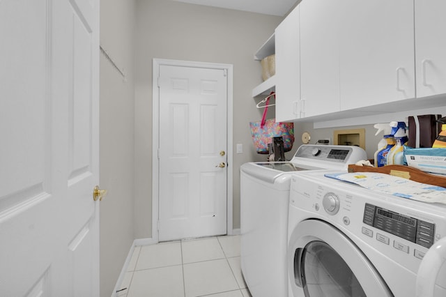 6179 Evian Pl, Boynton Beach, FL 33437 - laundry room with separate washer and dryer, cabinet space, light tile patterned flooring, and baseboards