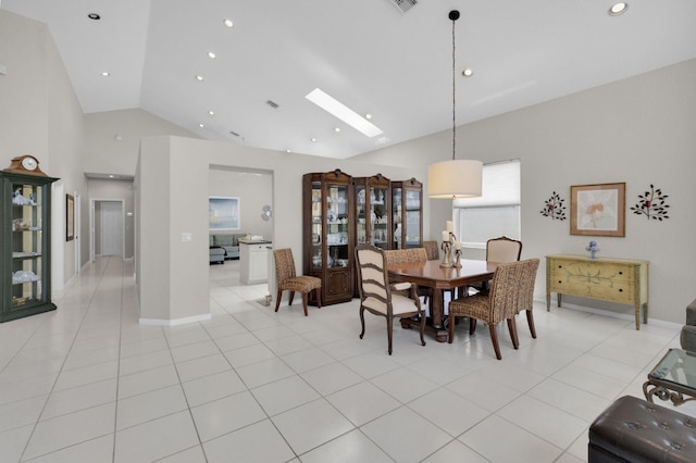6179 Evian Pl, Boynton Beach, FL 33437 - dining area with high vaulted ceiling, light tile patterned flooring, a skylight, recessed lighting, and baseboards