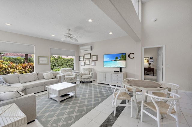 6179 Evian Pl, Boynton Beach, FL 33437 - living room with ceiling fan, light tile patterned floors, recessed lighting, a wall unit AC, and baseboards