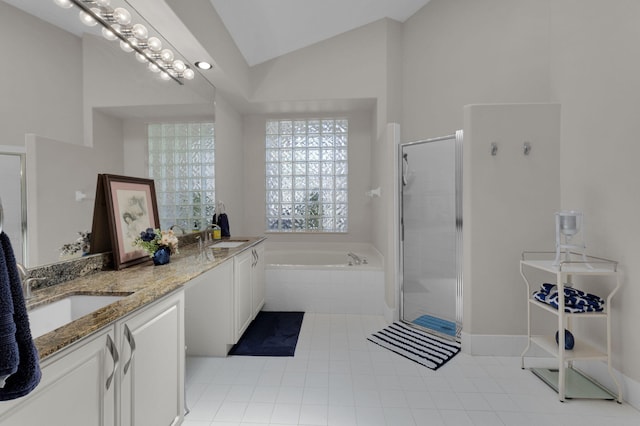 6179 Evian Pl, Boynton Beach, FL 33437 - bathroom with a bath, double vanity, a stall shower, vaulted ceiling, and tile patterned floors