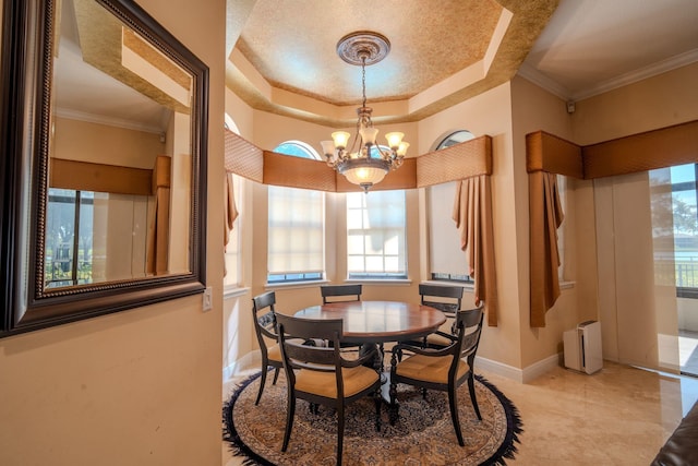 8979 Three Rail Dr, Boynton Beach, FL 33472 - dining room featuring healthy amount of natural light, a chandelier, a tray ceiling, baseboards, and crown molding