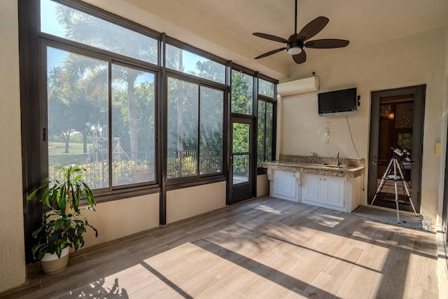 8979 Three Rail Dr, Boynton Beach, FL 33472 - unfurnished sunroom featuring a wall mounted air conditioner and a sink