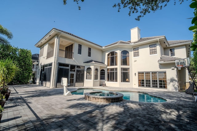 8979 Three Rail Dr, Boynton Beach, FL 33472 - back of house with stucco siding, a chimney, a patio, and a balcony