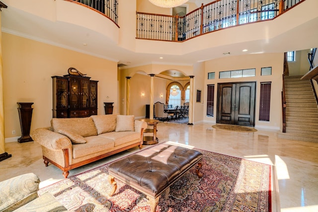 8979 Three Rail Dr, Boynton Beach, FL 33472 - living room with arched walkways, a towering ceiling, stairway, baseboards, and marble tiled floors