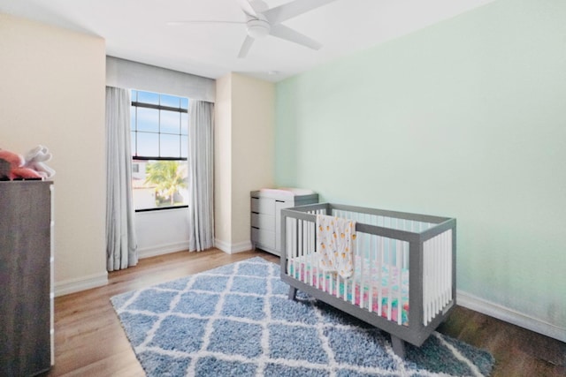 9196 Grand Prix Ln, Boynton Beach, FL 33472 - bedroom with wood finished floors, baseboards, and a ceiling fan