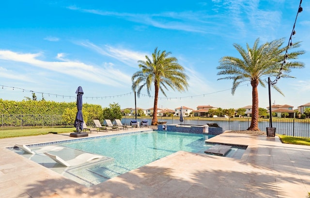 9196 Grand Prix Ln, Boynton Beach, FL 33472 - view of swimming pool featuring a patio area, a pool with connected hot tub, and a residential view