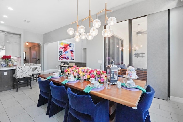 9196 Grand Prix Ln, Boynton Beach, FL 33472 - dining room featuring light tile patterned floors, arched walkways, recessed lighting, and a ceiling fan