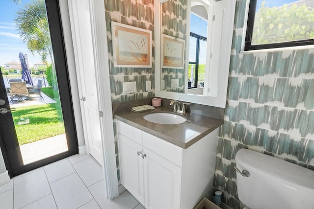 9196 Grand Prix Ln, Boynton Beach, FL 33472 - half bath featuring toilet, vanity, and tile patterned flooring
