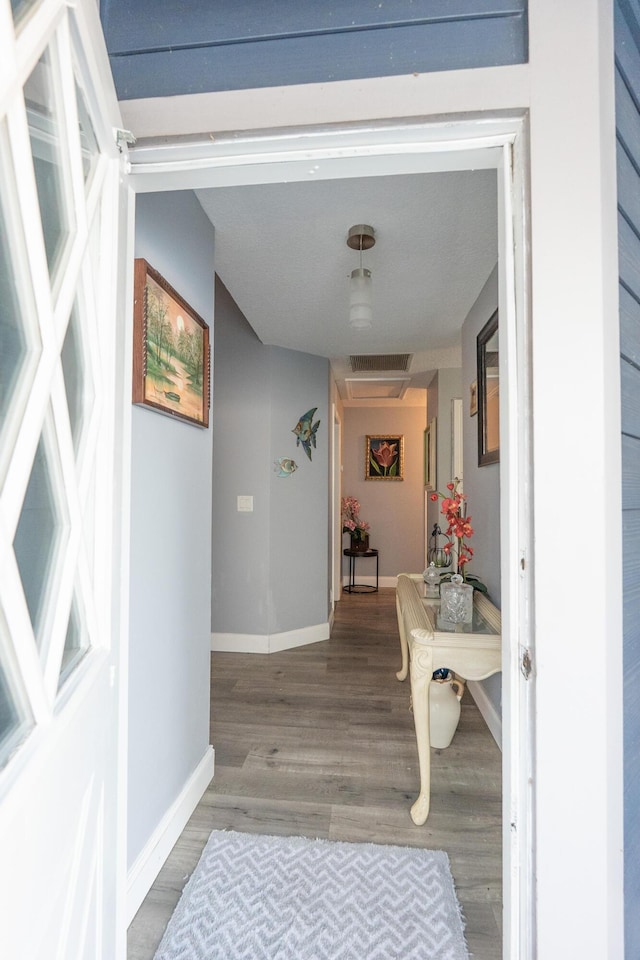 1325 Strawberry Ln, West Palm Beach, FL 33415 - hall with wood finished floors and baseboards