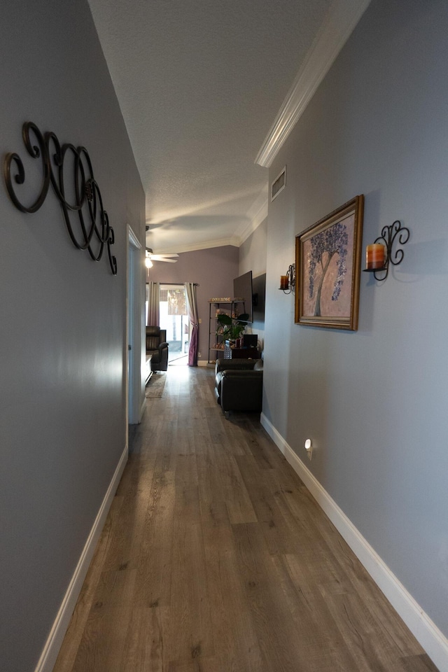 1325 Strawberry Ln, West Palm Beach, FL 33415 - hallway featuring dark wood-type flooring, crown molding, and baseboards