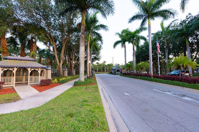 1325 Strawberry Ln, West Palm Beach, FL 33415 - view of asphalt street with street lights and curbs
