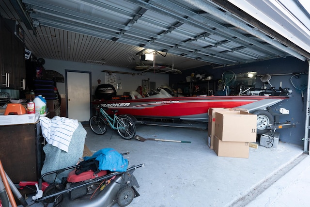 1325 Strawberry Ln, West Palm Beach, FL 33415 - garage featuring a garage door opener