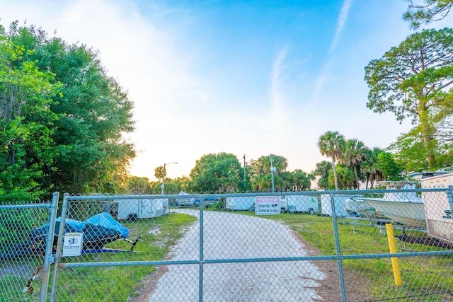 1325 Strawberry Ln, West Palm Beach, FL 33415 - view of street featuring street lights and a gated entry