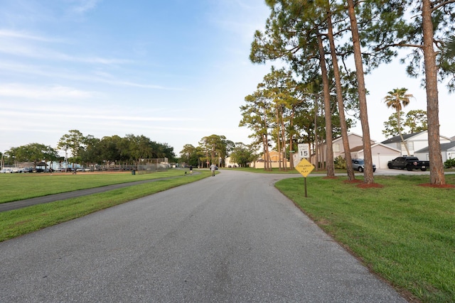 1325 Strawberry Ln, West Palm Beach, FL 33415 - view of asphalt street with traffic signs and a residential view
