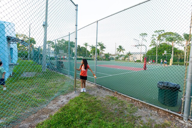 1325 Strawberry Ln, West Palm Beach, FL 33415 - view of tennis court featuring community basketball court