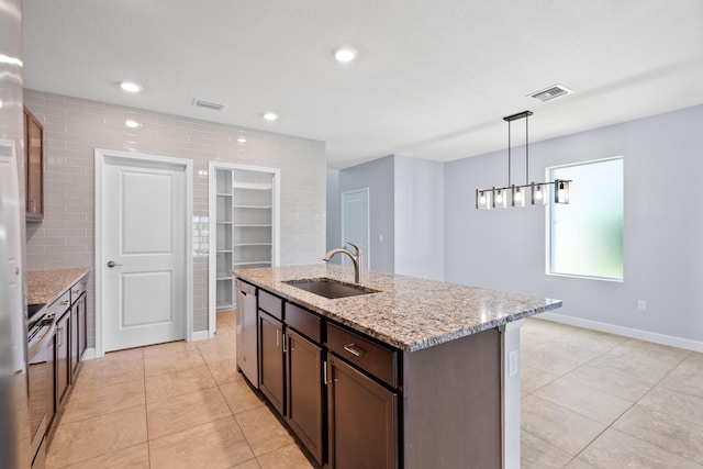 852 Gairloch Ln, Fort Pierce, FL 34947 - kitchen with a sink, dishwasher, light tile patterned floors, baseboards, and recessed lighting