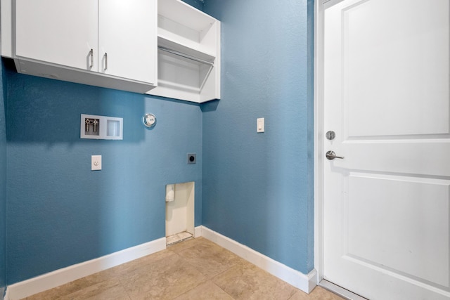 852 Gairloch Ln, Fort Pierce, FL 34947 - laundry area with electric dryer hookup, baseboards, hookup for a washing machine, and cabinet space