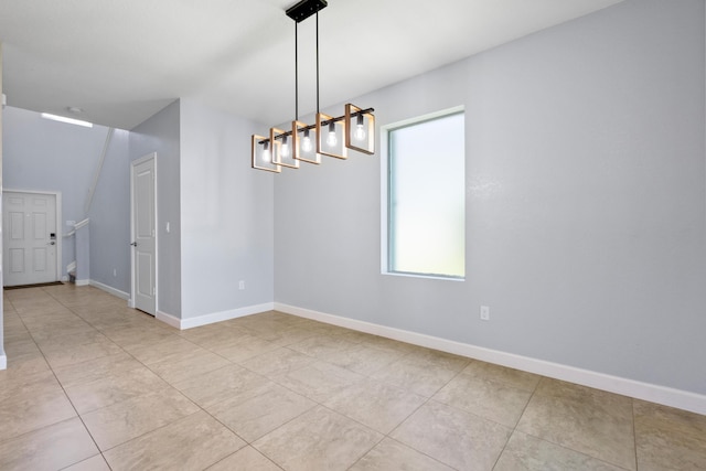 852 Gairloch Ln, Fort Pierce, FL 34947 - spare room with baseboards and light tile patterned floors