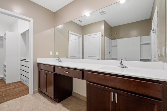 852 Gairloch Ln, Fort Pierce, FL 34947 - full bath with double vanity, a shower, and a spacious closet