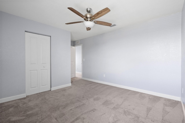 852 Gairloch Ln, Fort Pierce, FL 34947 - unfurnished bedroom with carpet floors, a closet, baseboards, and ceiling fan