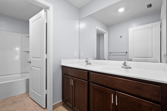 852 Gairloch Ln, Fort Pierce, FL 34947 - full bath with double vanity, tile patterned flooring, and bathtub / shower combination